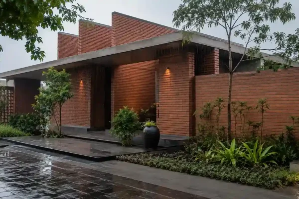 Well-maintained cladding brick wall on Gujarat home during monsoon season
